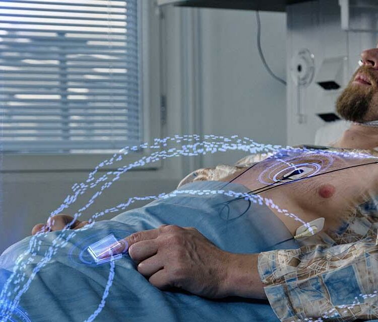 Patient lying in bed wearing EEG and ECG sensors for monitoring, with digital overlays representing data transmission from the devices.