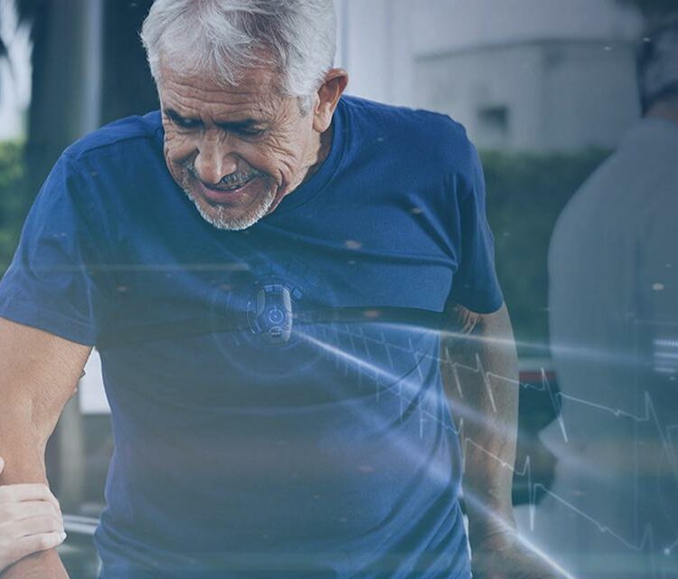 Healthcare worker assisting an elderly man with physical therapy, using parallel bars for rehabilitation.